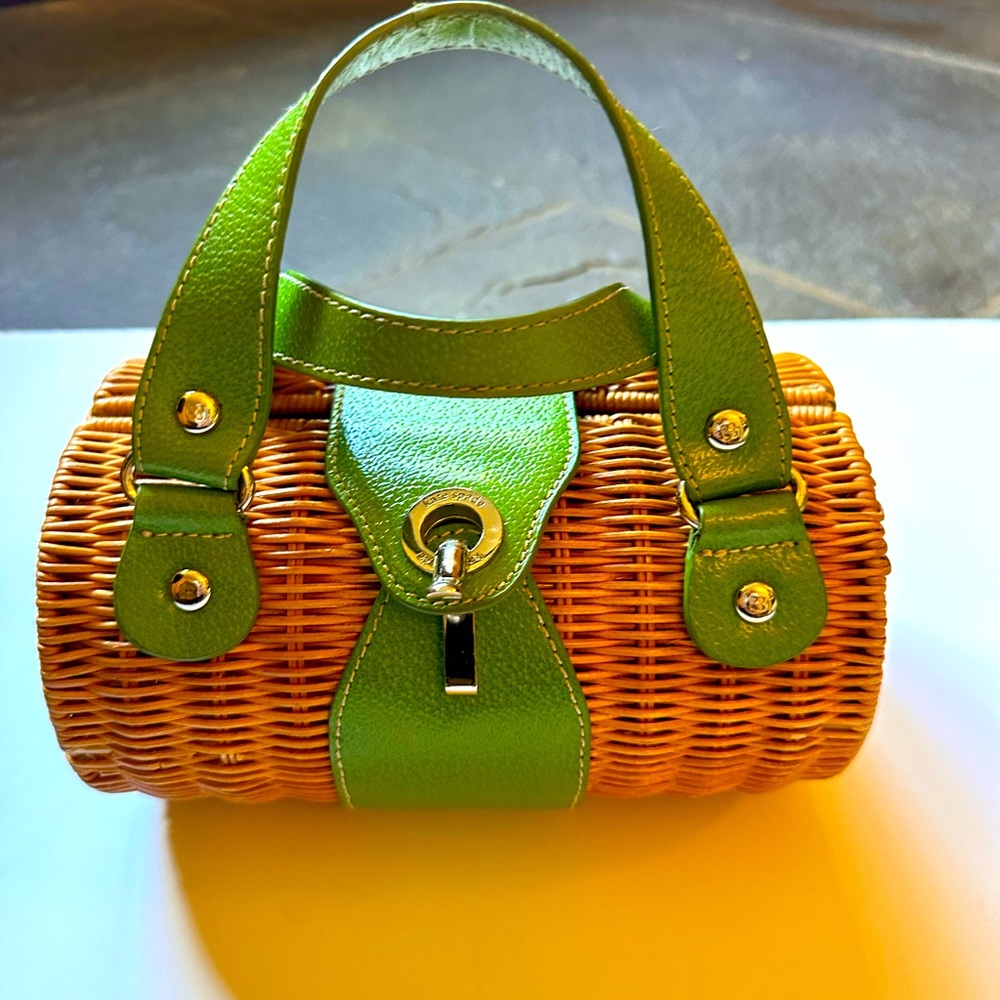 Kate Spade wicker handbag. Natural wicker w green leather straps.